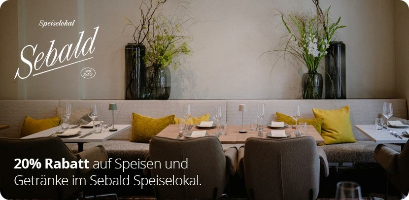 Eingerichtetes Speiselokal Sebald mit eingedeckten Tischen, Sitzbänken und Dekoration, 20% Rabatt auf Speisen und Getränke.