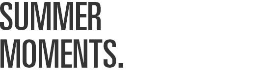 The words SUMMER MOMENTS are displayed in bold, dark grey capital letters on a white background.