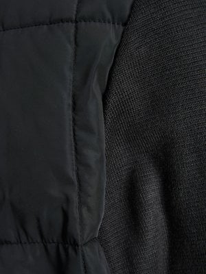 Prošívaná bunda s pletenými rukávy 
