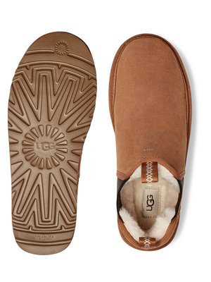 Pair of brown UGG Neumel slippers; one slipper shown from the sole, displaying a patterned tread and UGG logo; the other shown from the top, revealing a suede upper, shearling lining, and a visible UGG label inside.