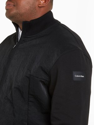 Lightweight jacket with rubberised label patch
