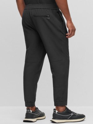 Chinos in techlite fabric with four-way stretch, water-repellent  