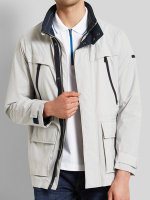 Lightweight-functional-jacket-with-hood-in-the-collar,-Rainseries-