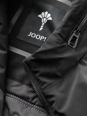 Water-repellent blouson with stretch content and logo patch