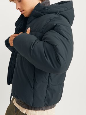 Puffer jacket with hood and label lettering