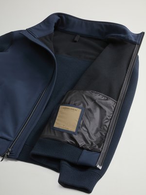 Hybrid softshell jacket with knit inserts