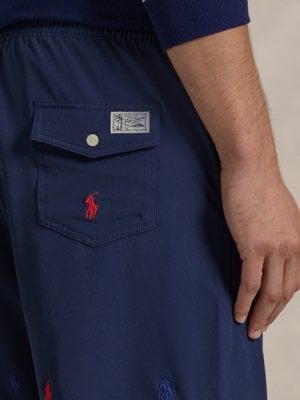 Swimming trunks with all-over embroidered logo and stretch fabric