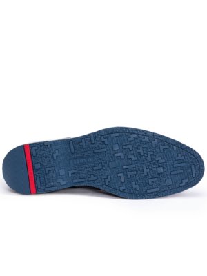 The image shows the sole of a shoe. The sole is navy blue with a red strip on the heel. There is a geometric pattern etched in the navy blue. The brand name is written on the sole.