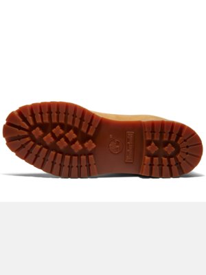 Widok od spodu żółtego buta roboczego. Podeszwa z brązowej gumy z wyraźnym bieżnikiem. Na podeszwie widoczne logo Timberland.