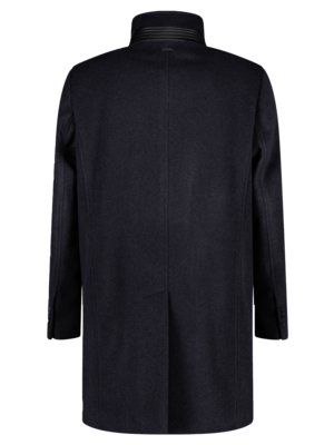 Rear view of a dark blue, knee-length overcoat. The coat has a high, stand-up collar with horizontal detailing. There are buttons on the sleeves and a center seam running down the back.
