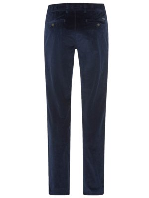 Dark navy blue corduroy pants are displayed against a white background. The pants have a button closure, belt loops, and back pockets. The image is a close-up, focused on the back of the trousers.