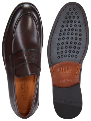 A dark brown leather penny loafer shoe is shown from above and its sole is shown next to it.