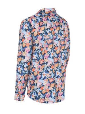 A long-sleeved shirt with a dark blue background and a busy floral print in pink, orange, and light blue.