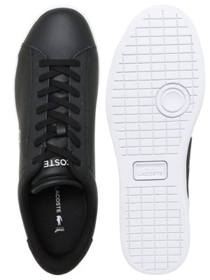 Black Lacoste sneakers displayed from top view and sole view, showing white sole and black laces.