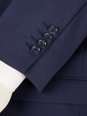 Business suit in a material mix