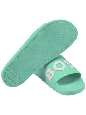 Trendy slides with 3D label in a contrasting colour