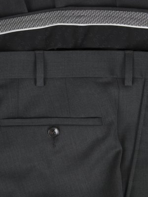 Close-up of dark grey dress pants. Visible details include the back pocket with a button, belt loops, and the waistband. The interior lining of the pants is visible at the top.