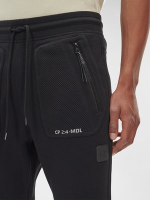 Jogginghose mit Taschen in Netz-Optik