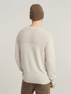 Rollkragenpullover aus Baumwolle mit kombinierten Strickmustern