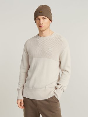 Rollkragenpullover aus Baumwolle mit kombinierten Strickmustern