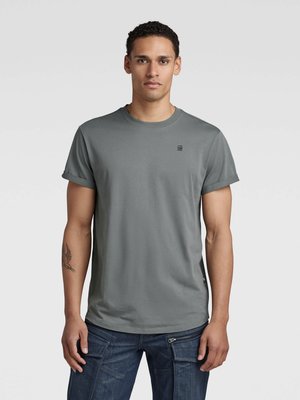 Leichtes T-Shirt mit abgerundetem Saum und Label-Print