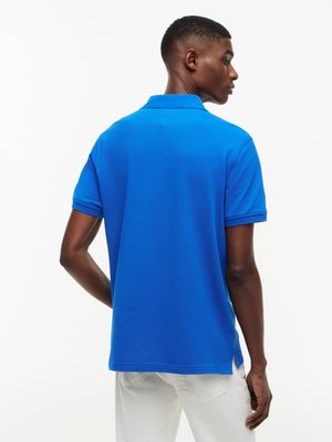 Unifarbenes Poloshirt 1985 und kleiner Flag-Stickerei, Regular Fit