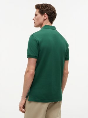 Unifarbenes Poloshirt 1985 und kleiner Flag-Stickerei, Regular Fit